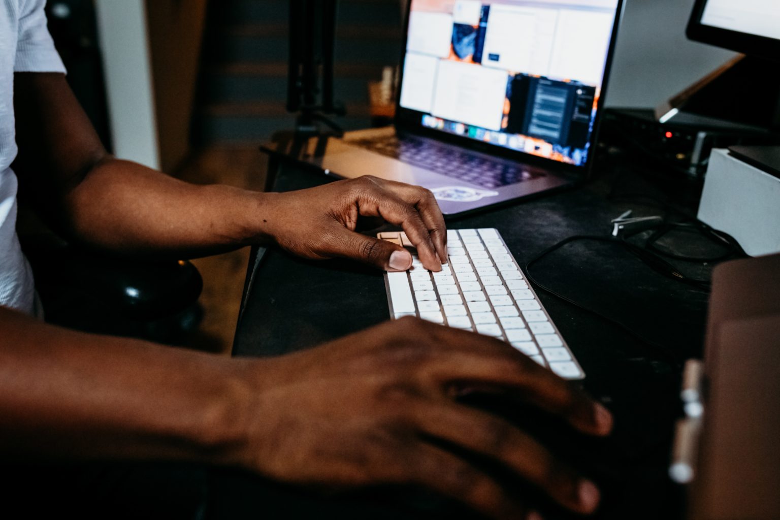 Typing on laptop